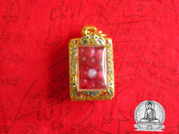 Red Sarira relic beads in a golden reliquary. #92